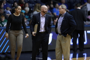 John Marcum (center) was an assistant coach at Butler for three seasons, and he helped lead the Bulldogs to a WNIT Sweet 16 appearance in 2019.
