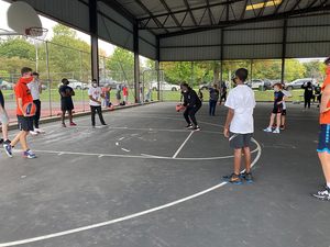 Participants played basketball and received free sneakers, a backpack and optional haircuts.
