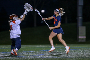 Kimber Hower defends a shot against Virginia. The Cavaliers' 18 goals were the most Syracuse has allowed all season.